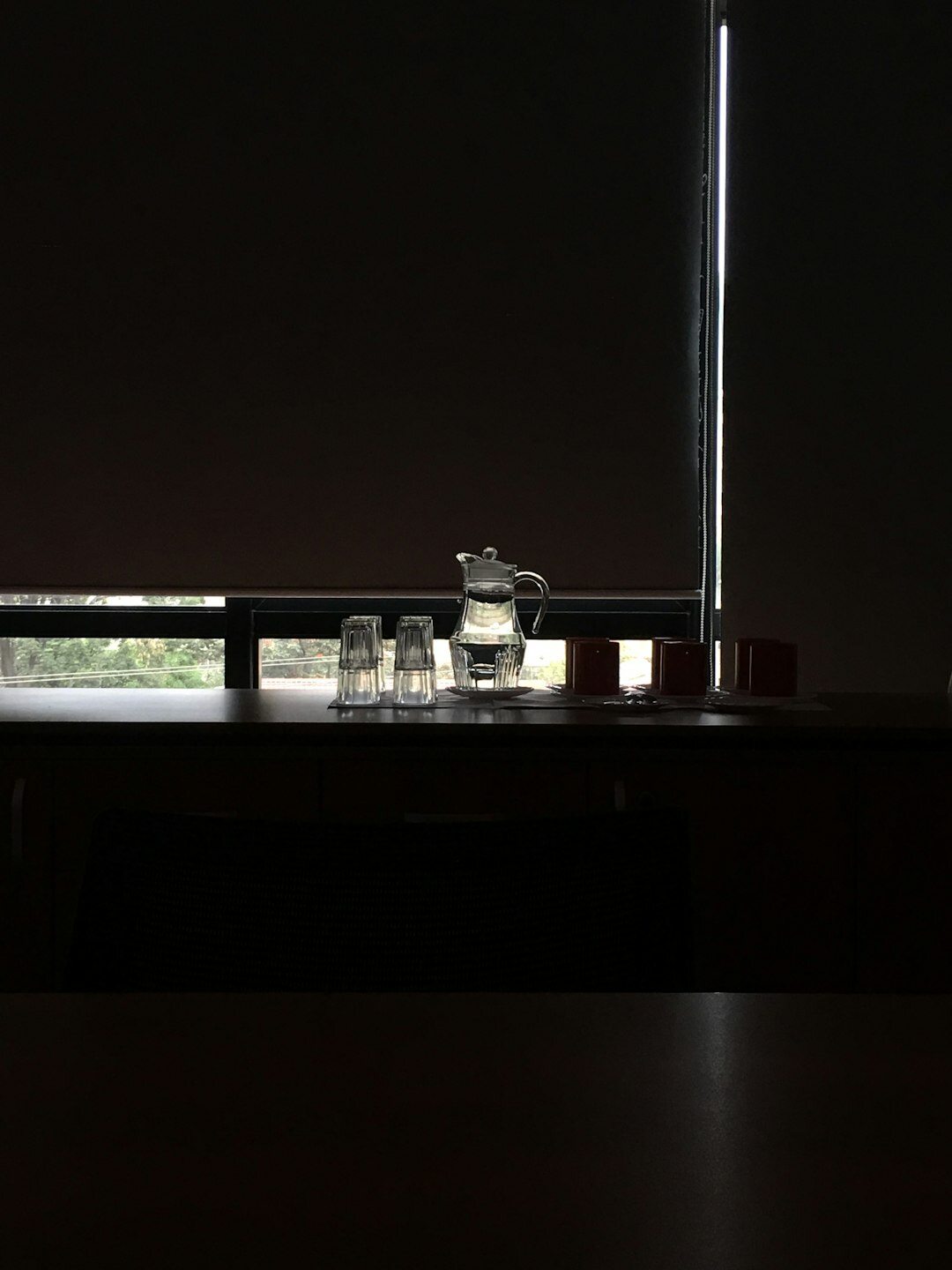 Empty formal meeting room with a long table and chairs used for negotiations