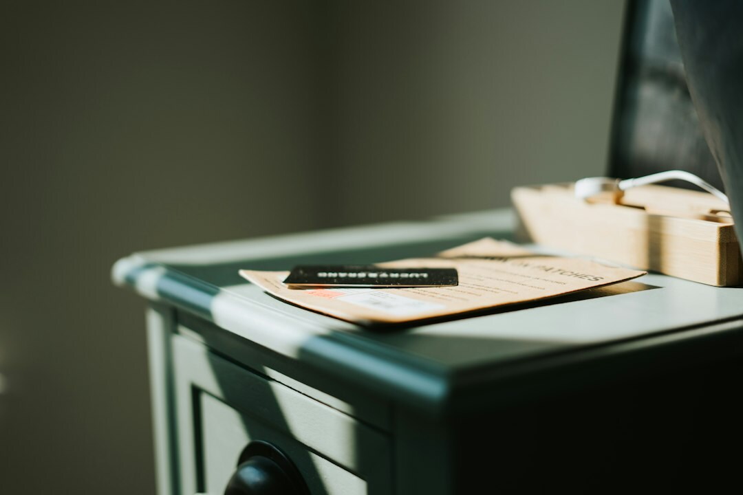 Desk covered with documents, a magnifying glass and a laptop used for investigative research