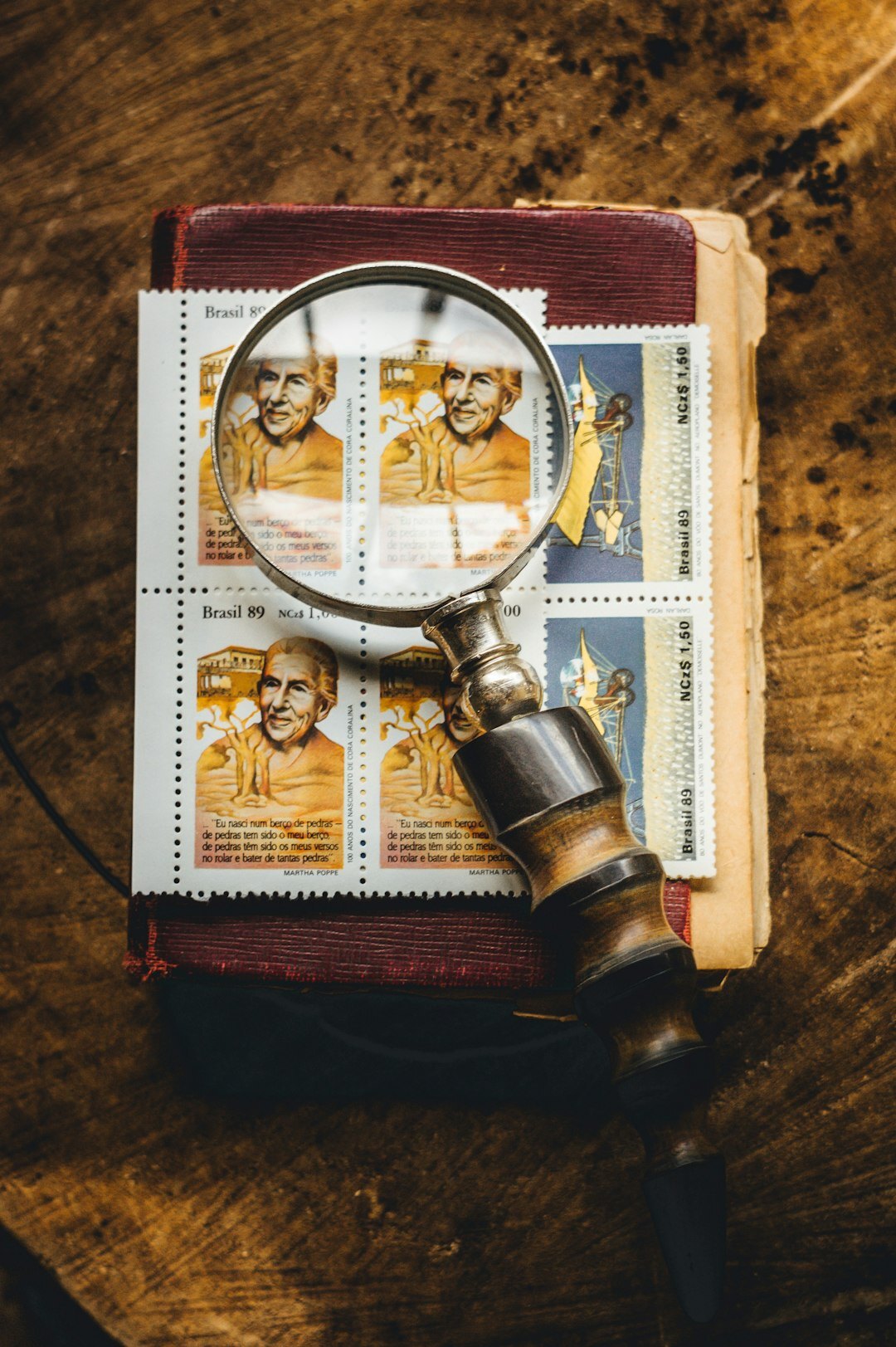documents on desk with magnifying glass